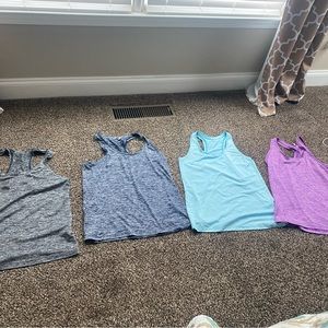 Under Armour set of 4 workout tanks